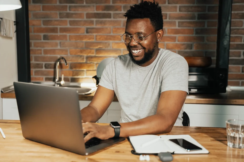 happy guy using laptop